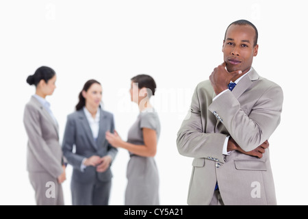 Thoughtful businessman with co-workers Stock Photo