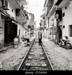 Life beside the train tracks in Old City of Hanoi in Vietnam in Far East Southeast Asia. Slum Rail Railway Poverty Urban Reportage Lifestyle Travel Stock Photo