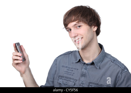 Young man holding a mobile phone Stock Photo