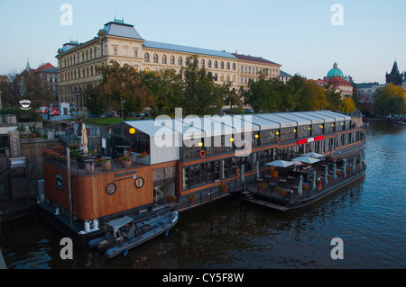 Floating boat restaurant started in 2012 in front of old town on river Vltava central Prague Czech Republic Europe Stock Photo