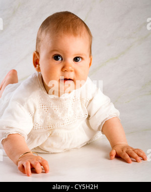 SIX MONTH OLD BABY GIRL,CRAWLING Stock Photo