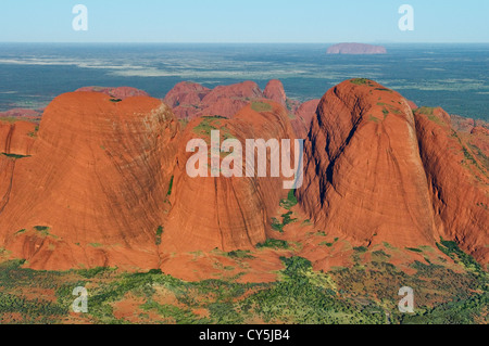 Aerial of the western domes of Kata Tjuta with Uluru in the distance. Stock Photo