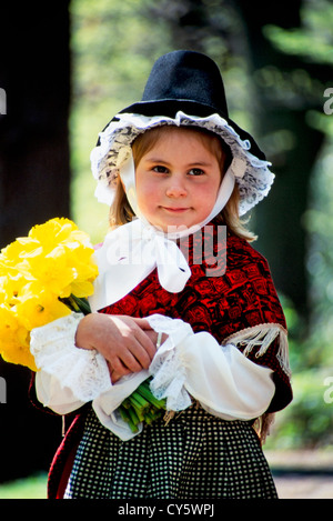 Welsh girl holding daffodils in national costume/dress Stock Photo - Alamy