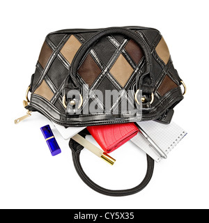 Open ladies leather handbag, red purse, perfume, lipstick, phone, notebook, pen, electronic book isolated on white background Stock Photo