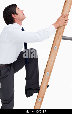 The young businessman climbing career ladder Stock Photo - Alamy