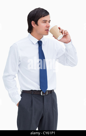 Tradesman drinking coffee out of a paper cup Stock Photo