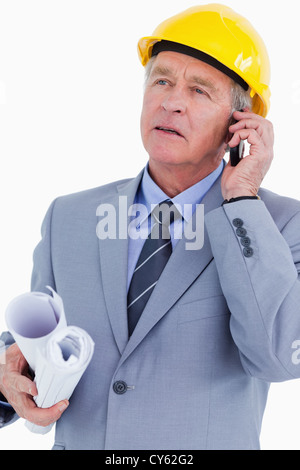 Mature architect on his mobile phone Stock Photo