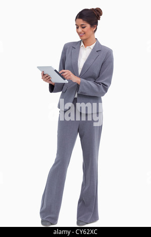 Smiling female entrepreneur working on her tablet computer Stock Photo
