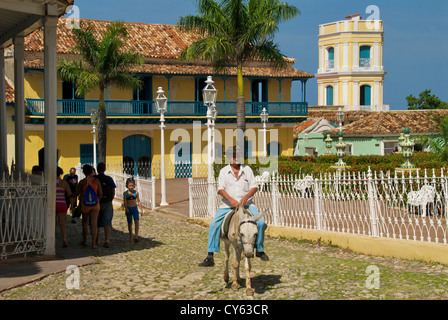 Man on donkey Plaza Mayor Trinidad Stock Photo