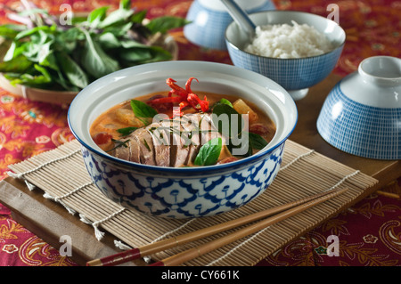 Thai red curry with roast duck Kaeng Phed Ped Yang Stock Photo