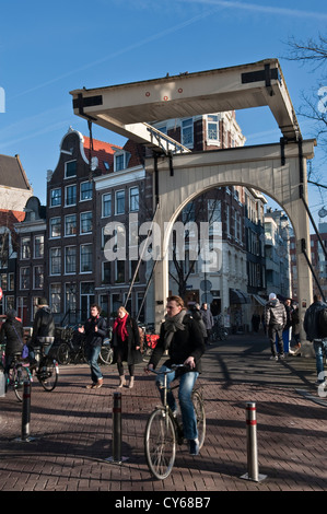 A 'balanced' bridge over the Groenburgwal canal on Staalstraat in Amsterdam city centre, the Netherlands. These are also known as bascule bridges Stock Photo