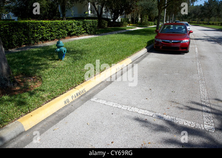 fire hydrant no parking curb in residential area of celebration florida usa Stock Photo