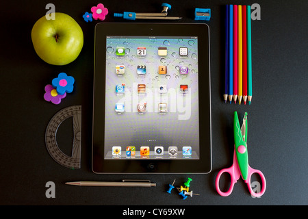 Ipad 3 with school accesories on white background Stock Photo