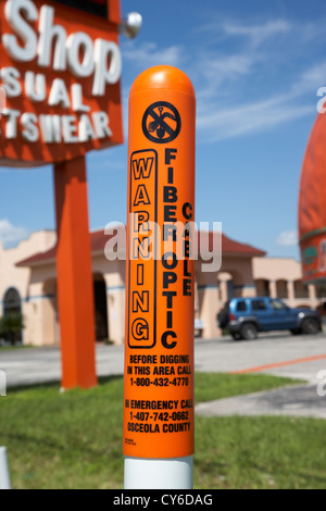 warning buried fiber optic cable marker in kissimmee florida usa Stock Photo