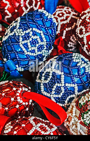 Eggs decorated with small beads and ribbons. Stock Photo