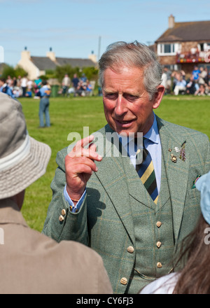 Charles, Prince of Wales taking to spectators at the summer highland games near the Castle of Mey, NE Highlands, Scotland Stock Photo