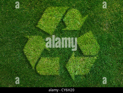 Green recycle Sign made from grass isolated on white. Stock Photo