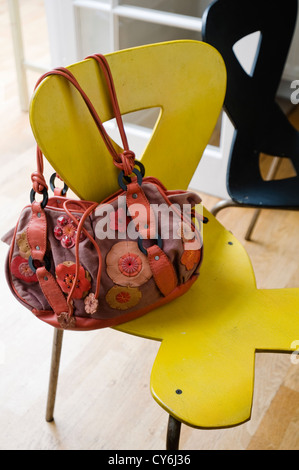 Seating area in window with patterned rug and glass chandelier Stock Photo