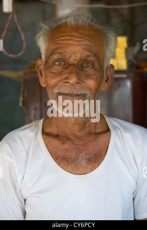 Shopkeeper in a roadside shop, Ambalappuzha, near Alappuzha (Alleppey), Kerala, India Stock Photo