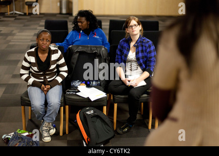 Three female African university students in classroom learning from lecturer Johannesburg South Africa 2012 Stock Photo