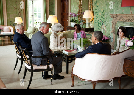 US President Barack Obama and First Lady Michelle Obama talk with the Prince of Wales and the Duchess of Cornwall, US Ambassador Louis Susman and Mrs. Margaret Susman May 24, 2011 at Winfield House in London, England. Stock Photo