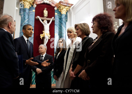 US President Barack Obama talks with family members of the victims of the Smolensk plane crash during his visit to the Field Cathedral of the Polish Military May 28, 2011 in Warsaw, Poland. Stock Photo