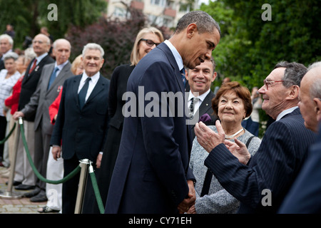 US President Barack Obama greets community leaders and Holocaust survivors after a wreath laying ceremony at the Warsaw Ghetto Memorial May 27, 2011in Warsaw, Poland. Stock Photo