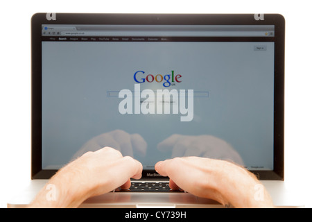 Point of view of a person using the google search engine on a laptop Stock Photo