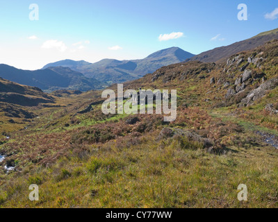 Eryri Snowdonia National Park North Wales October View across National Trust land towards Moel Hebog with ruins of old mine buildings Stock Photo