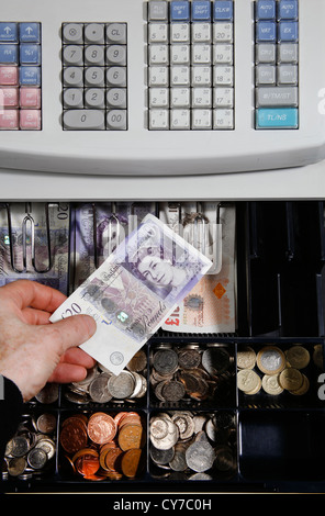 uk sterling ten and twenty pound notes in shop till Stock Photo