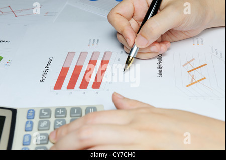 Business graph with hands, pen and calculator Stock Photo