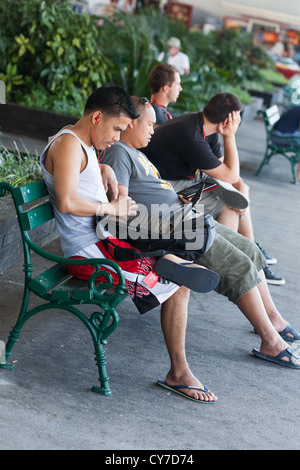 Cruise ship Crew member using free wifi at port of Dubrovnik to keep in touch with home Stock Photo