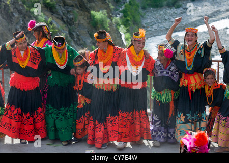 Kalash women and girls at the Grum Village Charso (dancing ground), Kalash Joshi (Spring Festival), Rumbur Valley, Chitral, Khyber-Pakhtunkhwa, Pakistan Stock Photo