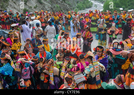 Kalash women and girls dancing at the Grum Village Charso (dancing ground), Kalash Joshi (Spring Festival), Rumbur Valley, Chitral, Khyber-Pakhtunkhwa, Pakistan Stock Photo