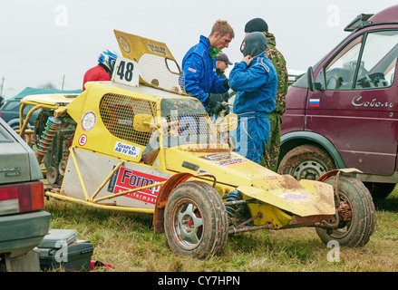 Yellow buggy-cart in racing car camping. Stock Photo