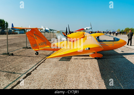 Light two-engine airplane for cruising and training on yellow colour. Stock Photo