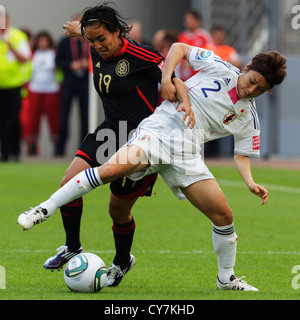 Monica Ocampo of Mexico (L) and Yukari Kinga of Japan (R) battle for the ball during a FIFA Women's World Cup Group B match.