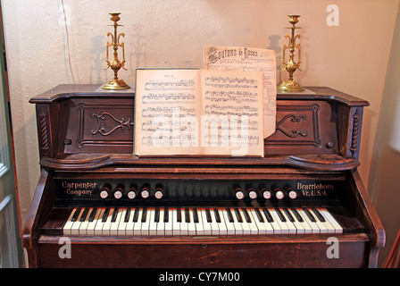 old-time harpsichord in dark room Stock Photo