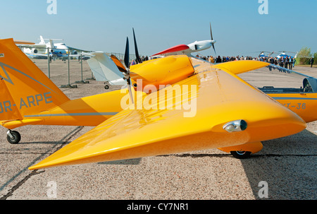 Light two-engine airplane for cruising and training on yellow colour - wing view. Stock Photo