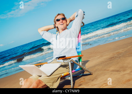 Young Business Man Relaxing on Tropical Beach Stock Photo