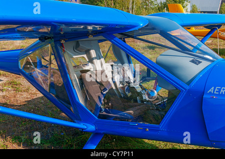 Light airplane for cruising and training on blue colour - cocpit view. Stock Photo