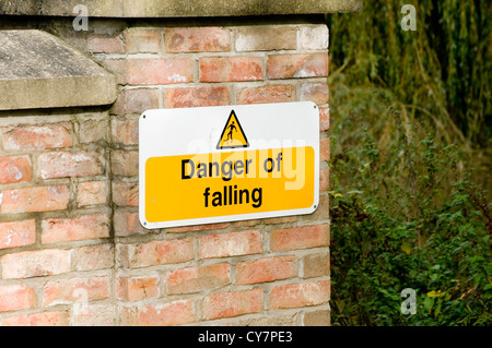 warning sign signs health and safety stating the obvious risk averse danger personal injury liability Stock Photo