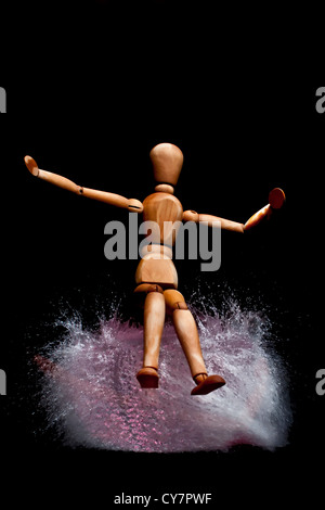 mannequin on an exploding water balloon. Stop motion High-Speed photography technique Stock Photo
