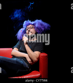 Man with purple wig. Stock Photo