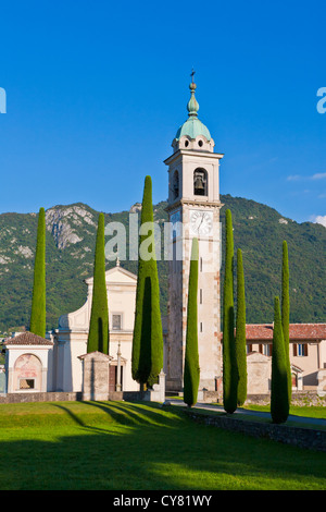 ALLEY OF CYPRESSES, SANT ABBONDIO CHURCH IN GENTILINO, NEAR MONTAGNOLA, LUGANESE, TICINO, SWITZERLAND Stock Photo