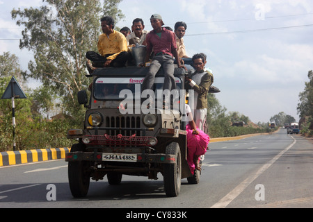 Overloaded Indian jeep taxi on Rajasthan, highway Stock Photo