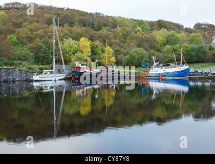 Crinan Canal with trawler, inshore cargo boat and yacht in Argyllshire, Scotland Stock Photo