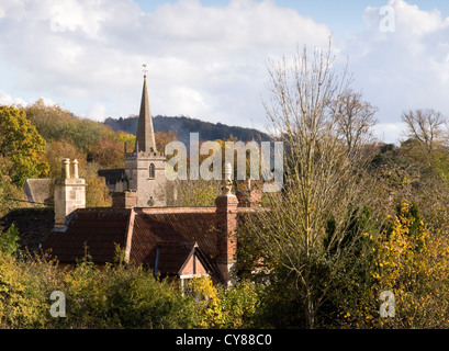 Lacock is a small village in the Wiltshire country side.Church spire and cottage roofs Stock Photo