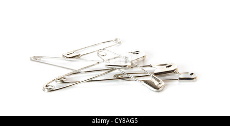 Few safety pins, one open, isolated on white background Stock Photo