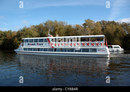 Broads river cruise tour boat on the River Bure near Wroxham, Norfolk, Broads National Park Stock Photo